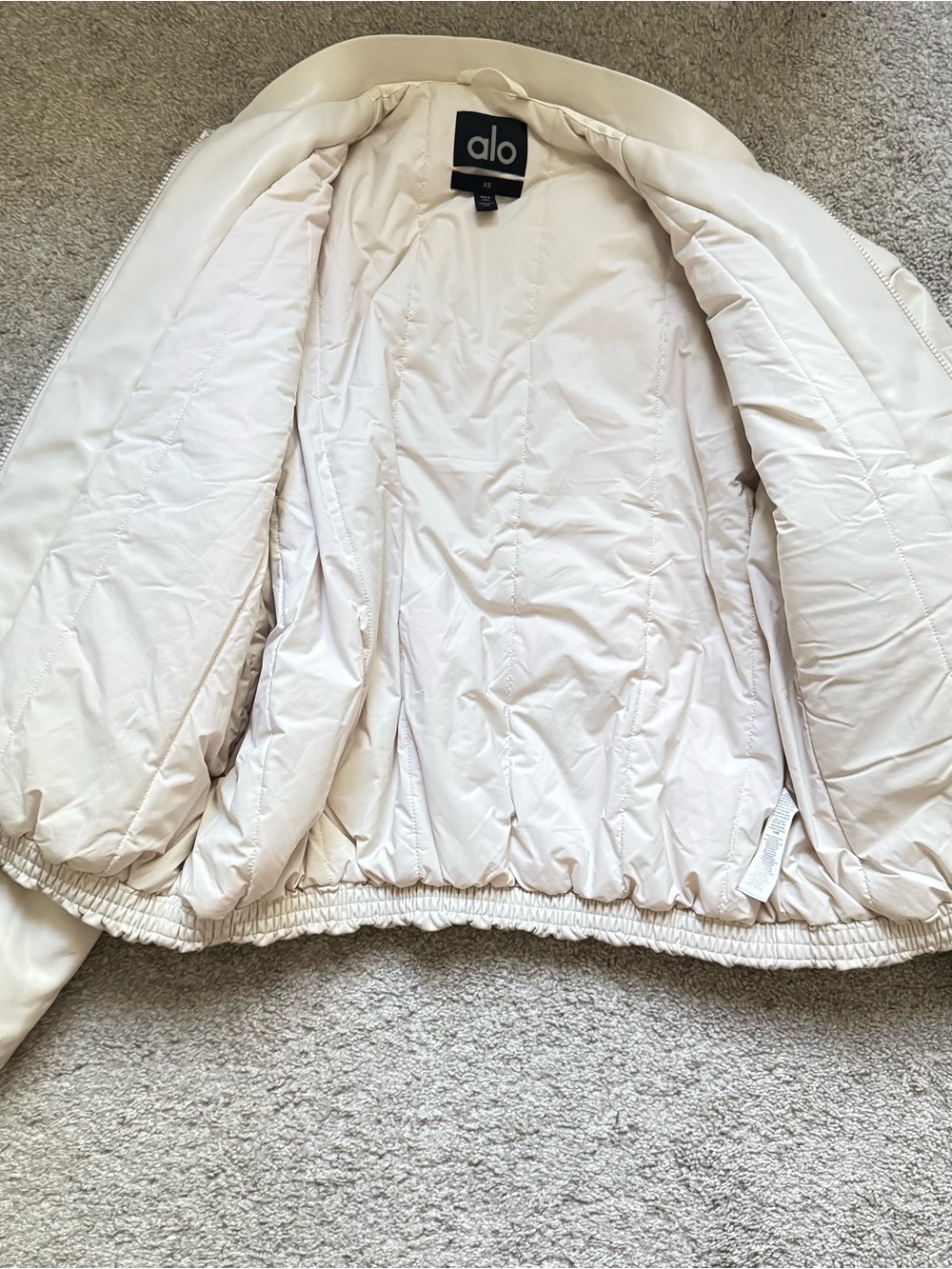 ALO Yoga Cream Faux-Leather Bomber Jacket - Picture 2 of 11